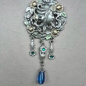 Elegant Silver and Gold Brooch with Blue Accents